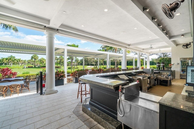 view of patio / terrace featuring exterior bar