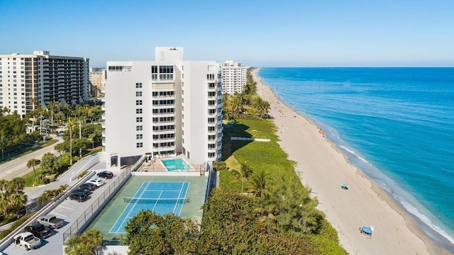 drone / aerial view featuring a view of the beach and a water view