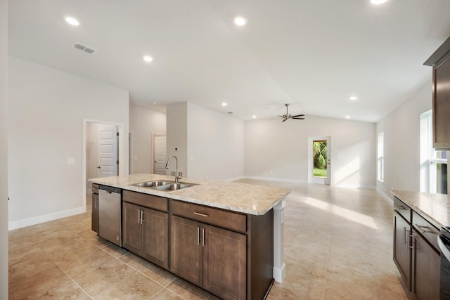 kitchen featuring sink, vaulted ceiling, stainless steel dishwasher, ceiling fan, and an island with sink