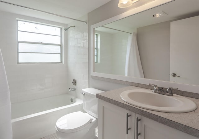 full bathroom with vanity, toilet, and shower / tub combo