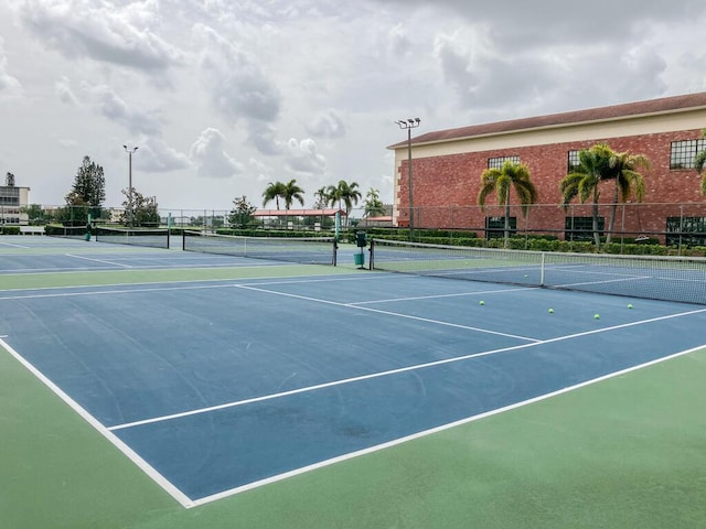 view of tennis court featuring basketball court