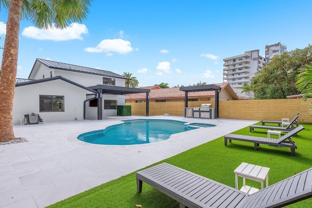 view of pool featuring a pergola, area for grilling, a patio area, and a yard