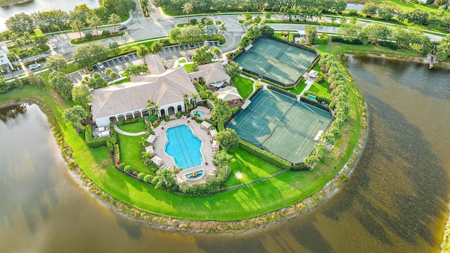 birds eye view of property with a water view