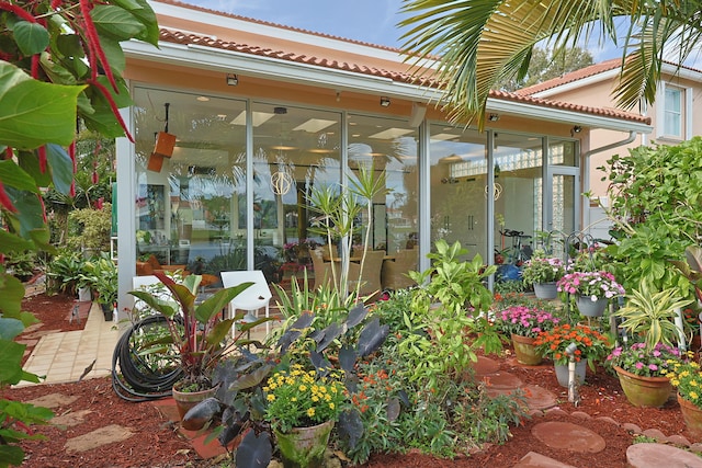 sunroom / solarium with a water view and a skylight