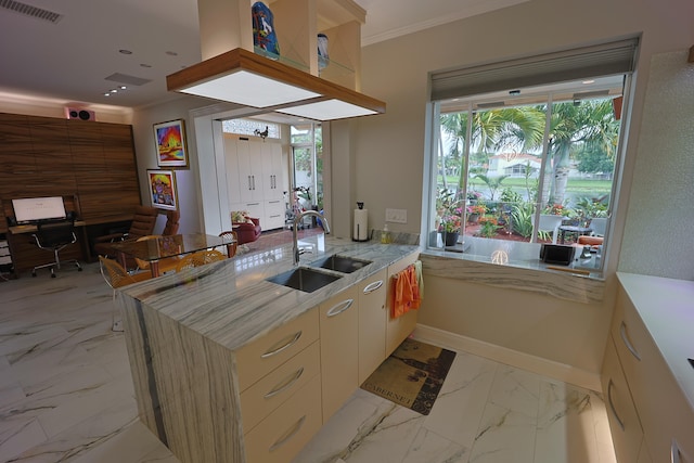 kitchen featuring black electric cooktop, stainless steel oven, sink, and wall chimney range hood