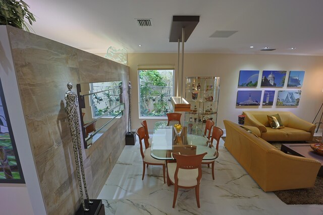 kitchen with sink, wall chimney range hood, paneled built in refrigerator, light stone counters, and black electric cooktop