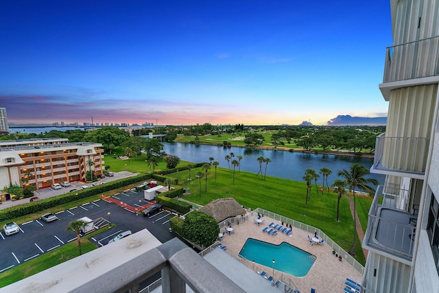 aerial view at dusk with a water view