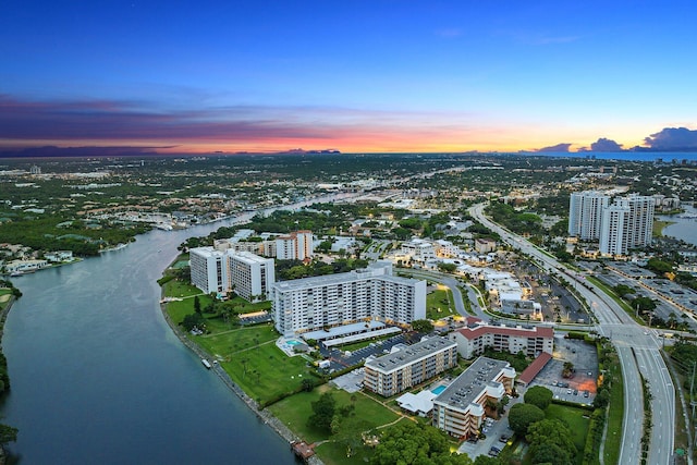 aerial view at dusk with a water view