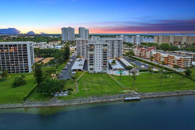 aerial view at dusk with a water view