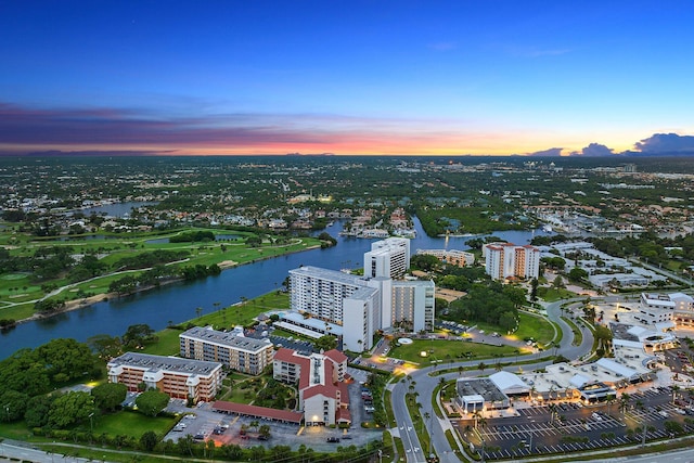 aerial view at dusk with a water view