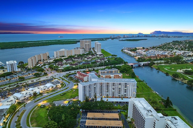 aerial view at dusk with a water view