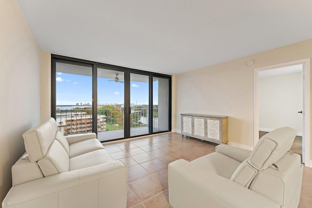 tiled living room with a wall of windows