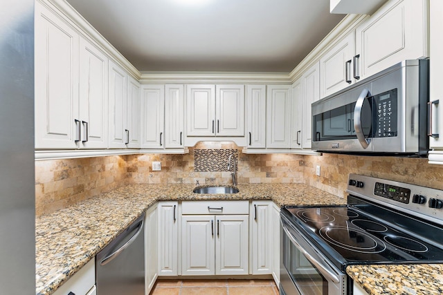 kitchen with white cabinetry, sink, and stainless steel appliances