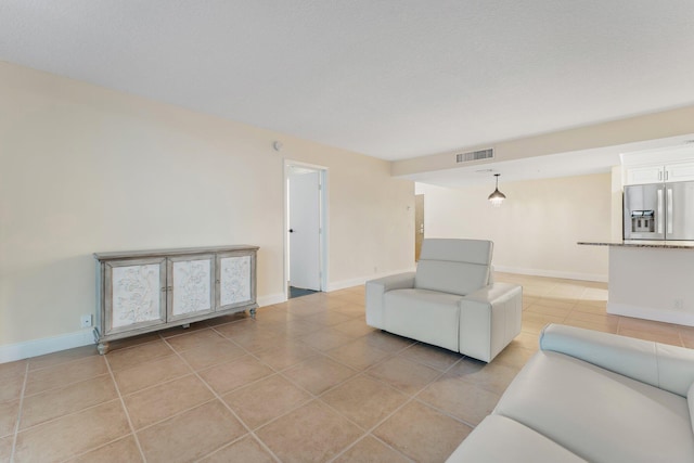 living room with light tile patterned flooring