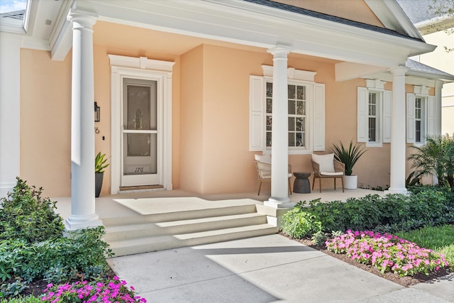 entrance to property with a porch