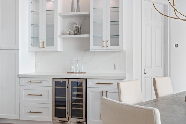 bar featuring white cabinetry and wine cooler