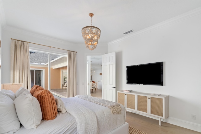 bedroom with a chandelier, light wood-type flooring, and ornamental molding