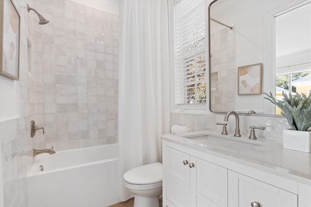 full bathroom with vanity, shower / bath combo, and toilet