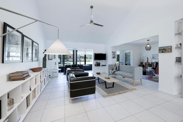 tiled living room featuring high vaulted ceiling and ceiling fan