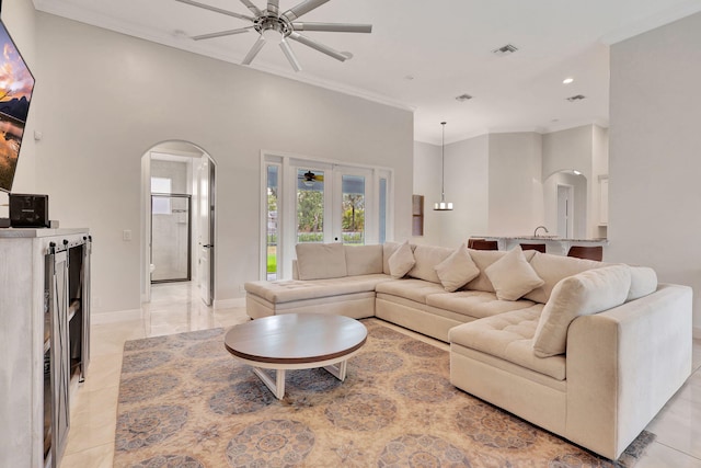 living room with french doors, light tile patterned floors, and ceiling fan