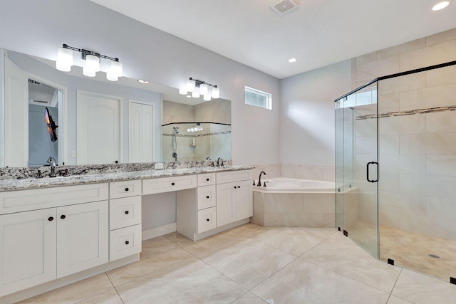 bathroom with tile patterned floors, vanity, and independent shower and bath