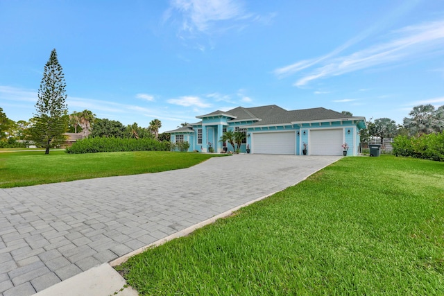 ranch-style house with a garage and a front lawn