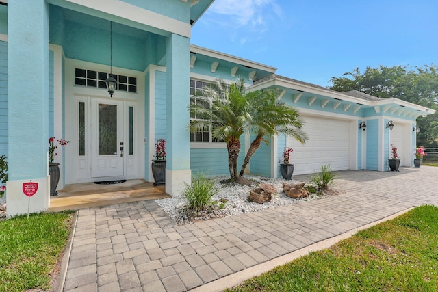 doorway to property featuring a garage