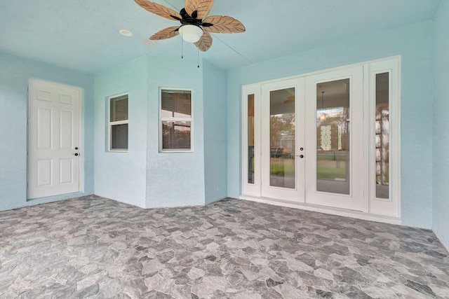 interior space featuring ceiling fan and french doors