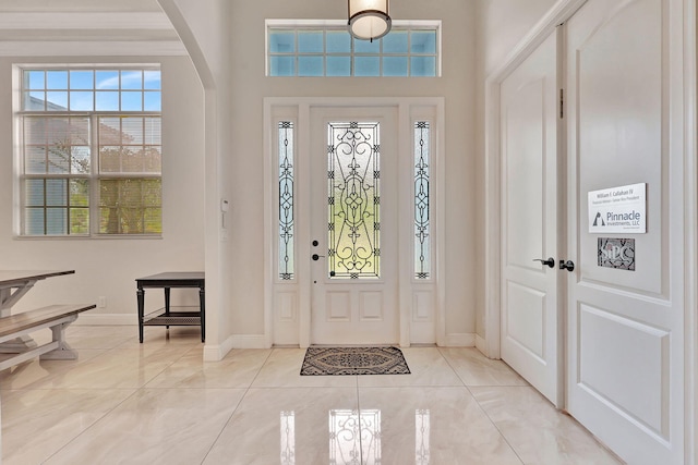 entryway with light tile patterned floors