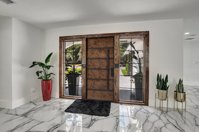 1001 W Palmetto Park Rd, Boca Raton, FL 33486 - entrance foyer featuring plenty of natural light, visible vents, marble finish floor, and baseboards