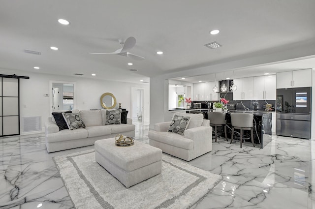 1001 W Palmetto Park Rd, Boca Raton, FL 33486 - living room featuring a barn door, visible vents, marble finish floor, and recessed lighting