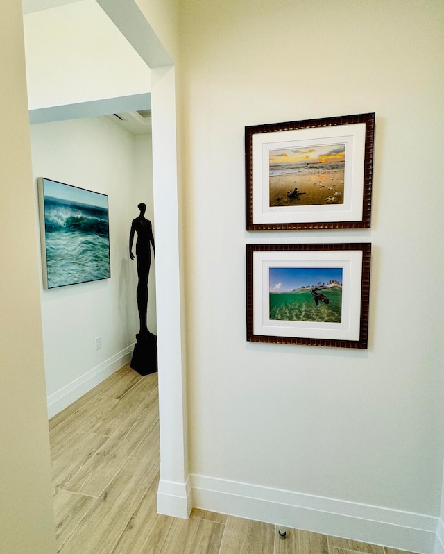 corridor featuring light hardwood / wood-style floors