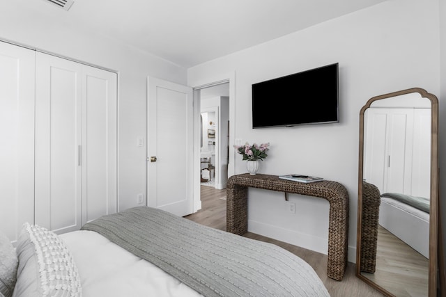 bedroom with hardwood / wood-style floors