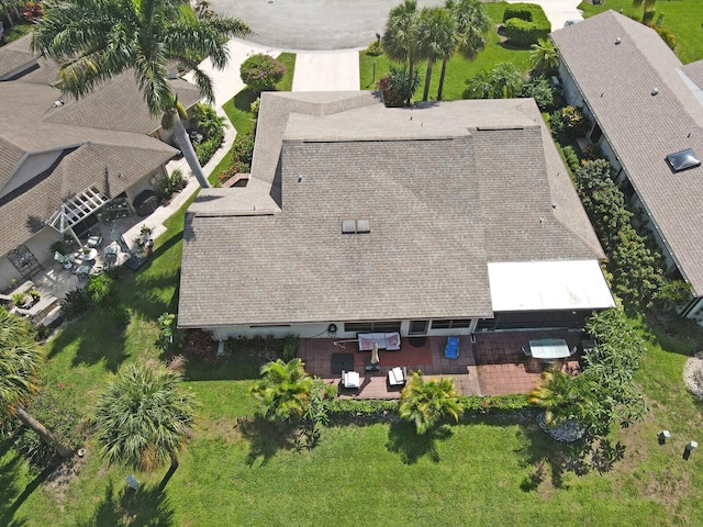 view of property's community with a lawn