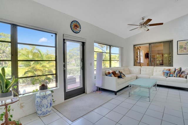 tiled living room with ceiling fan and lofted ceiling