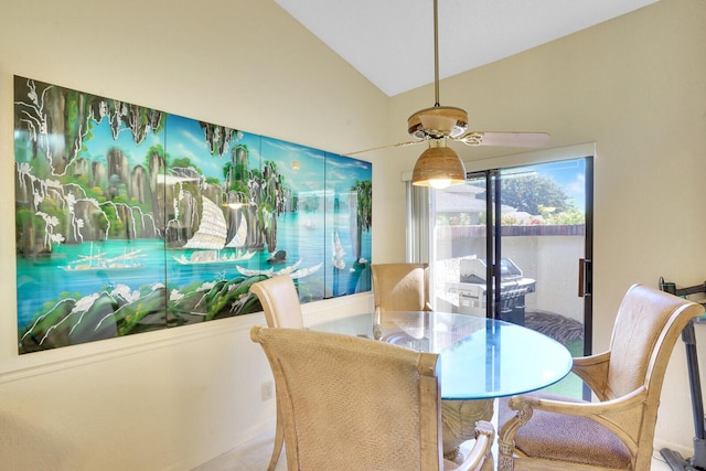 dining room featuring ceiling fan and vaulted ceiling