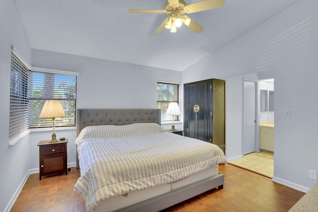 bedroom with ceiling fan, lofted ceiling, parquet floors, and multiple windows