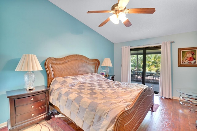 bedroom featuring ceiling fan, dark hardwood / wood-style flooring, lofted ceiling, and access to outside