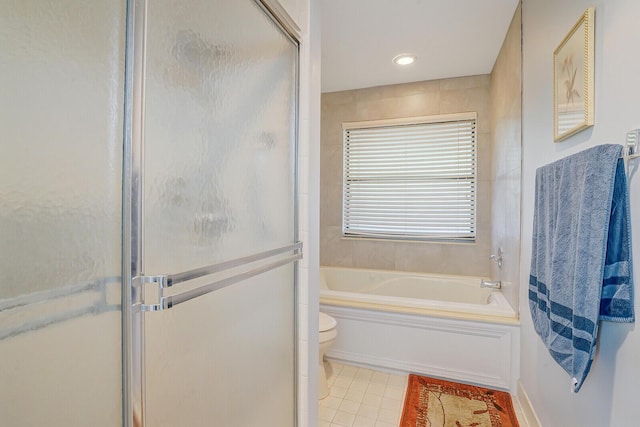 bathroom with toilet, tile patterned flooring, and shower with separate bathtub