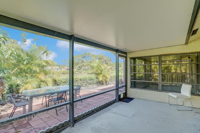 unfurnished sunroom with a wealth of natural light