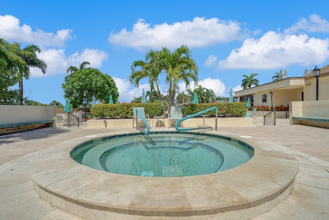 view of pool featuring a patio