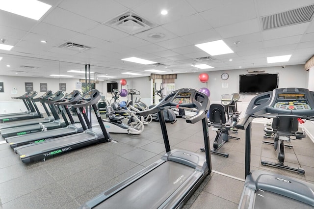 workout area featuring a drop ceiling and visible vents