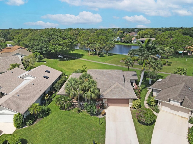 birds eye view of property featuring a water view