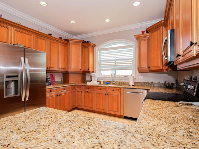 kitchen with ornamental molding, stainless steel appliances, sink, and light tile floors