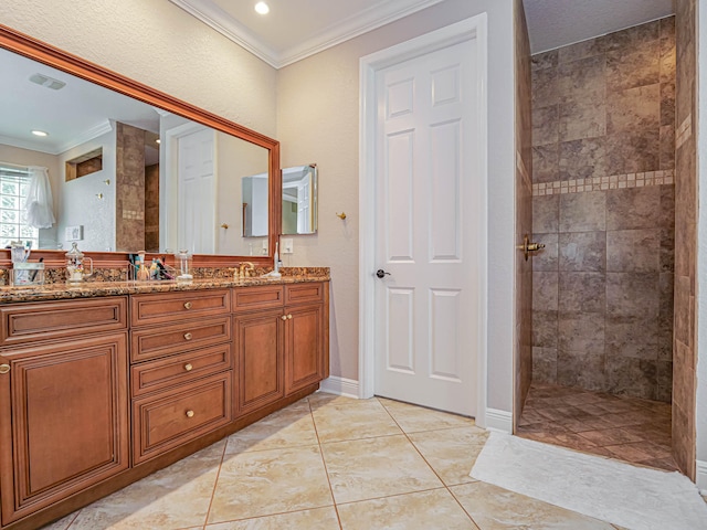 bathroom featuring tile floors, dual vanity, and ornamental molding