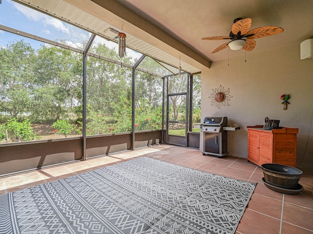 sunroom / solarium featuring ceiling fan