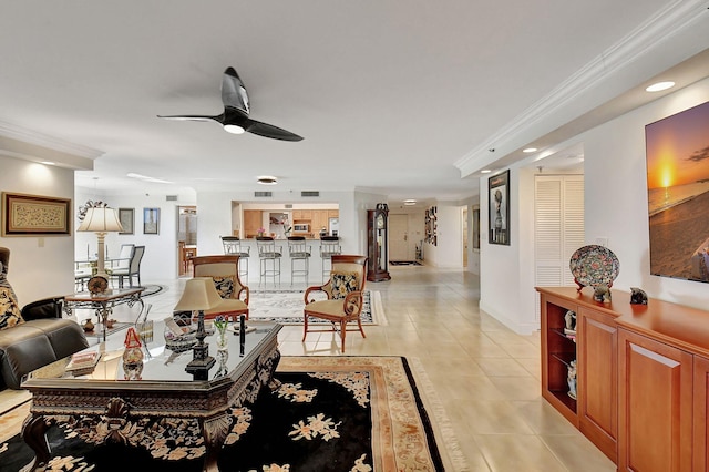 living room featuring ceiling fan, light tile patterned floors, and crown molding