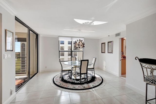 tiled dining room with ornamental molding and plenty of natural light