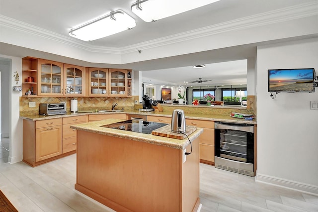 kitchen with wine cooler, black electric stovetop, crown molding, kitchen peninsula, and ceiling fan