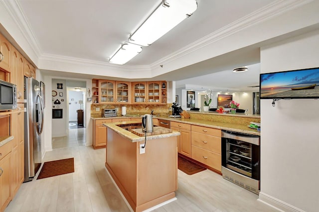 kitchen featuring ornamental molding, kitchen peninsula, a kitchen island, and wine cooler